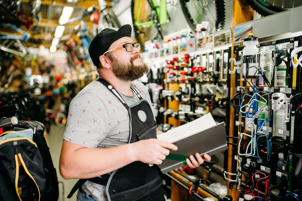 Store owner going over inventory.